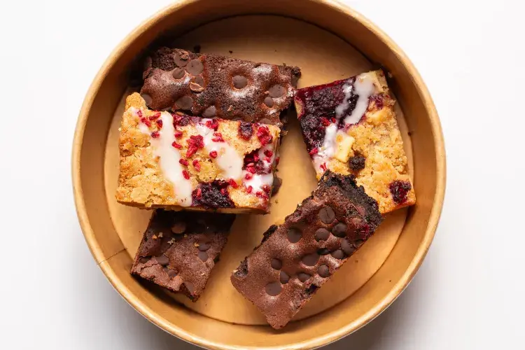traybakes and brownie slices in a bowl